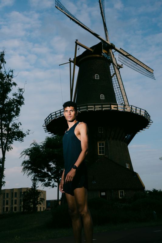 Noah standing in front of a windmill